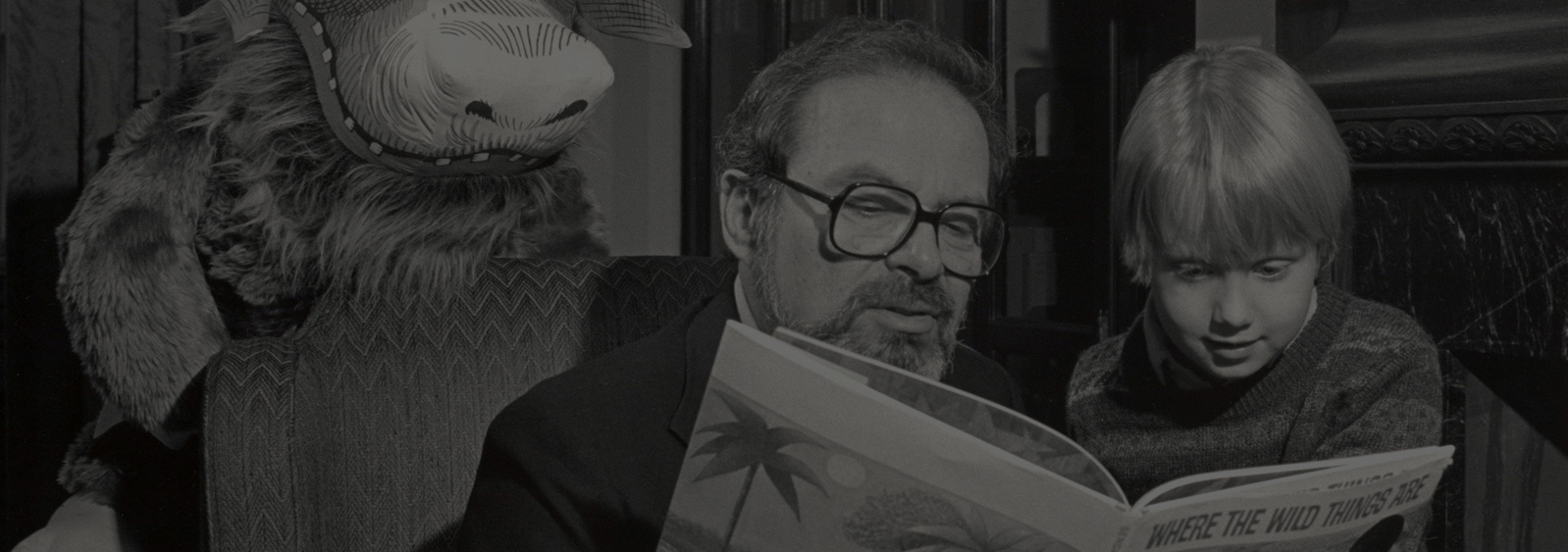Marice Sendak reading to a child