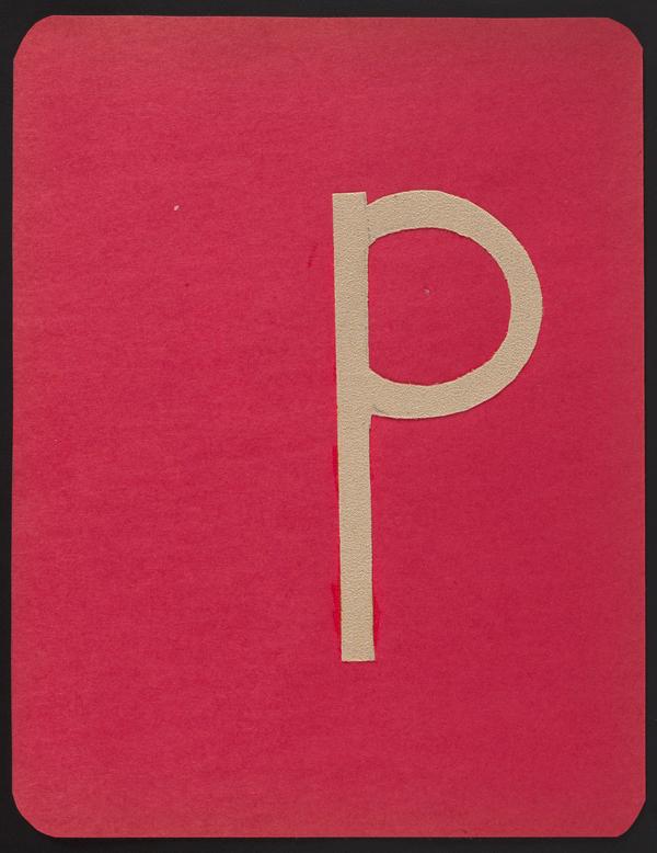 A photograph of a sandpaper letter