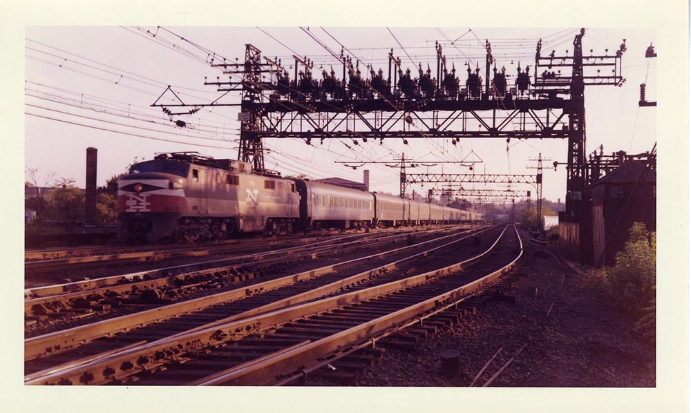 New Haven Railroad Train 360 with rectifier electric locomotive (EP-5) 370, traveling from Grand Central Terminal to New Haven, between Norwalk and South Norwalk, Connecticut.