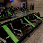 airport chairs with every other one covered so nobody will sit next to each other